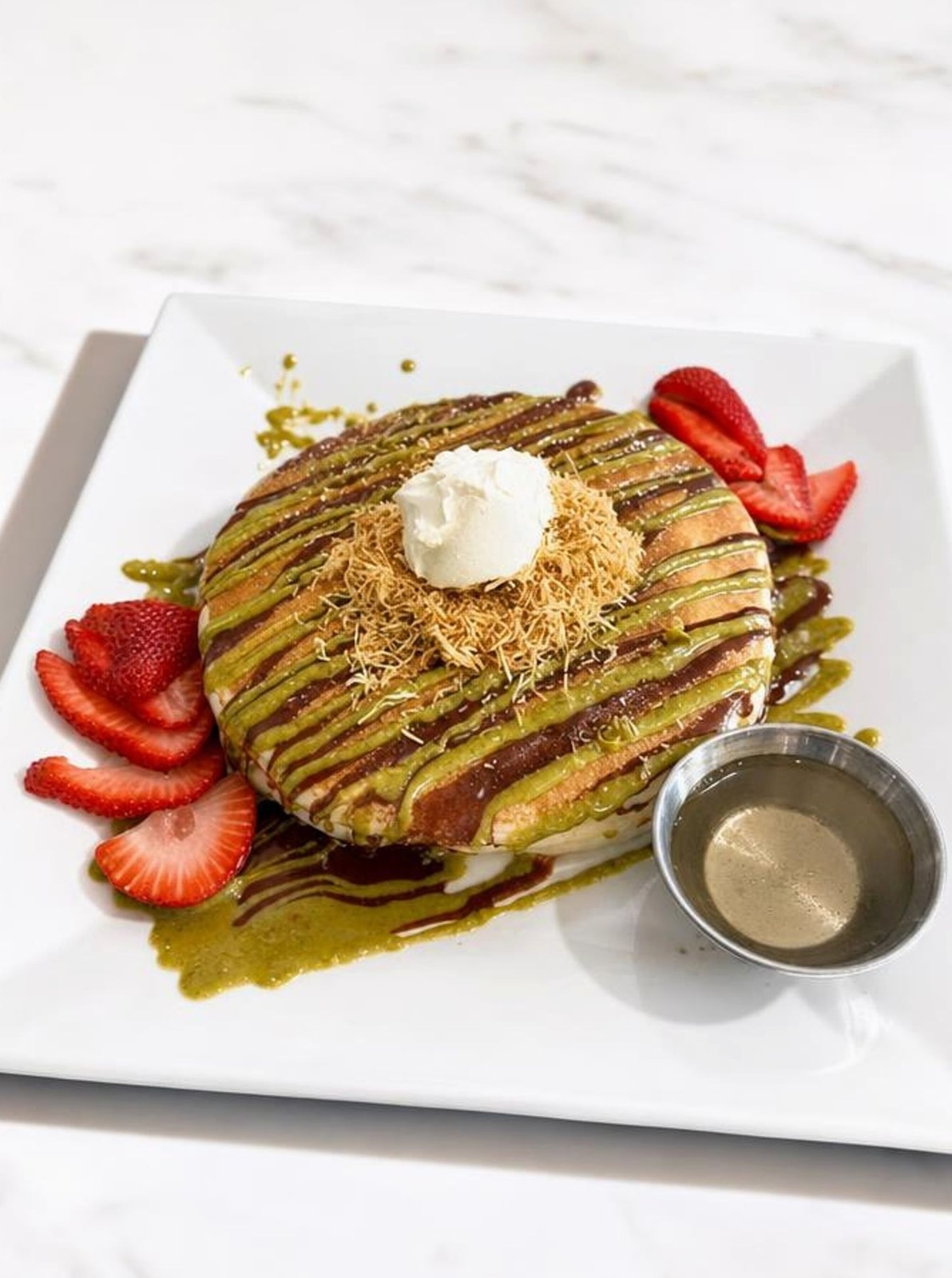 Dubai pancakes with pistachio kunafa, milk chocolate and strawberries