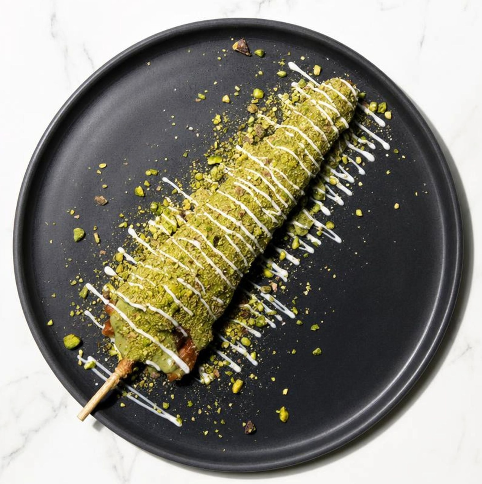 Pistachio waffle stick dipped in chocolate and crushed pistachio